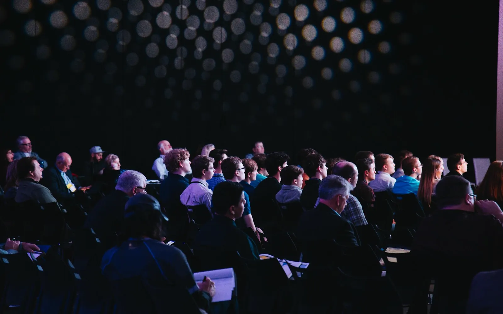 Attendees seated in a conference session